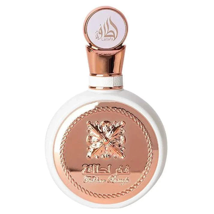Fakhar Lattafa Eau De Parfum bottle with rose gold and white design on a white background