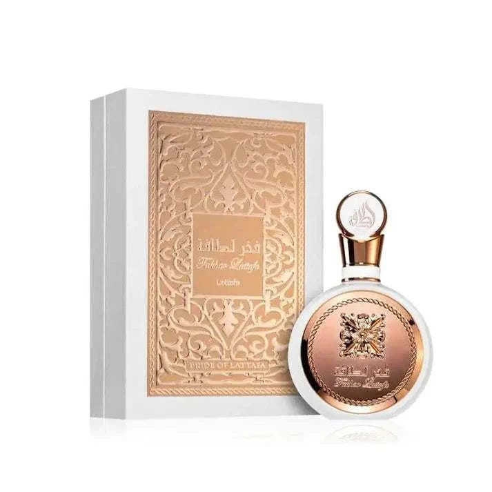 Fakhar Lattafa Eau De Parfum bottle with decorative box on a white background