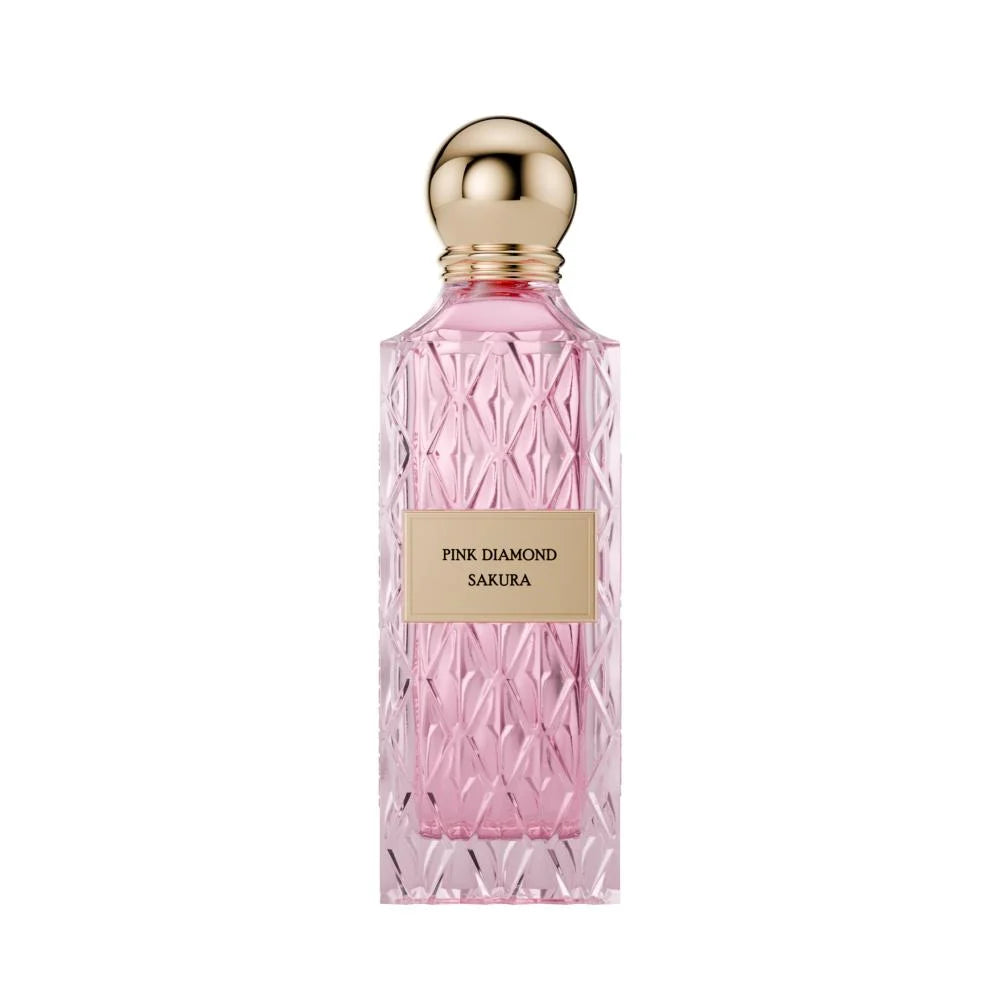 Pink diamond Sakura perfume bottle with gold cap on a white background